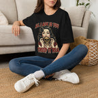 Seated model wearing the All I Ask Is You Creep It Real Halloween graphic tee in black