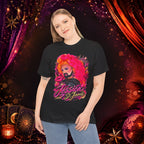 Model wearing the black Jessica St. James Glamour Portrait Tee against a dramatic red and purple stage backdrop