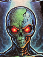 Extreme close-up of the green alien face and glowing red eyes on the Alien Signal tee