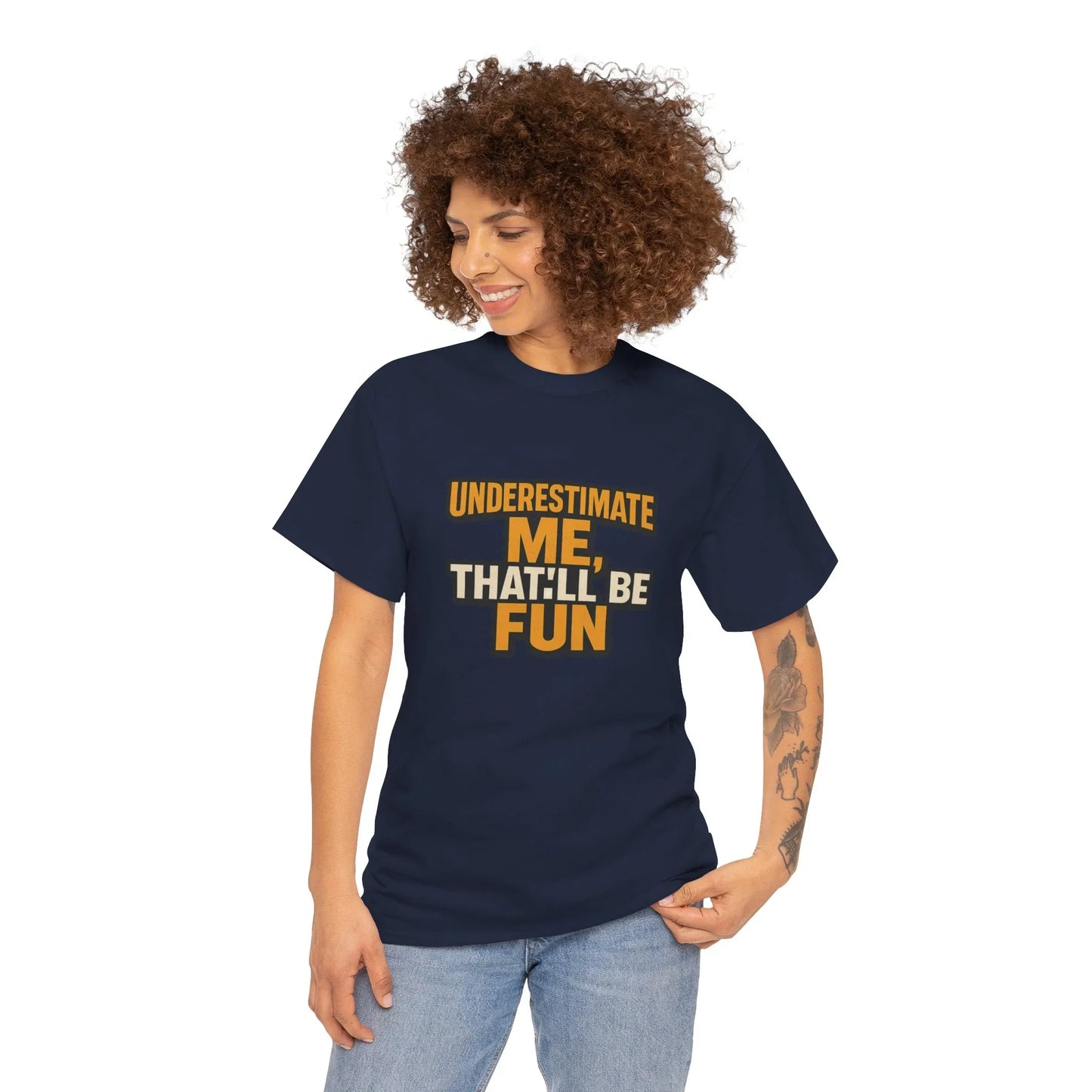Woman in navy graphic t-shirt with 'Underestimate me, that'll be fun' slogan, smiling