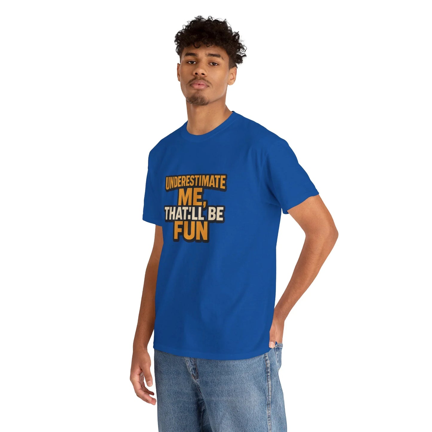 Man wearing blue graphic t-shirt with 'Underestimate me, that'll be fun' text, casual style