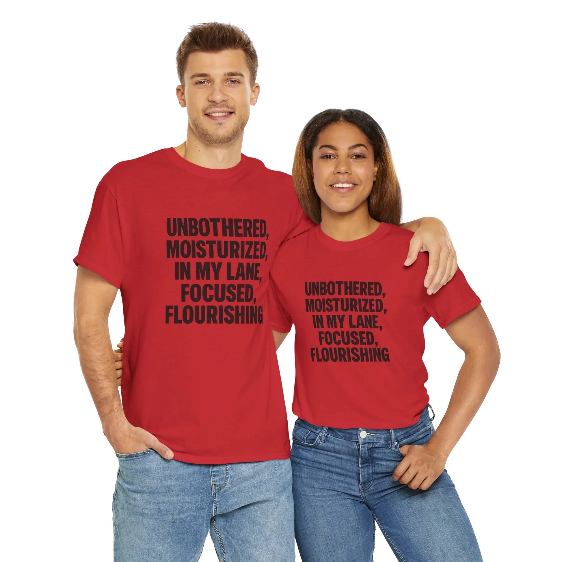 Smiling couple in matching red graphic t-shirts with motivational quote, white background