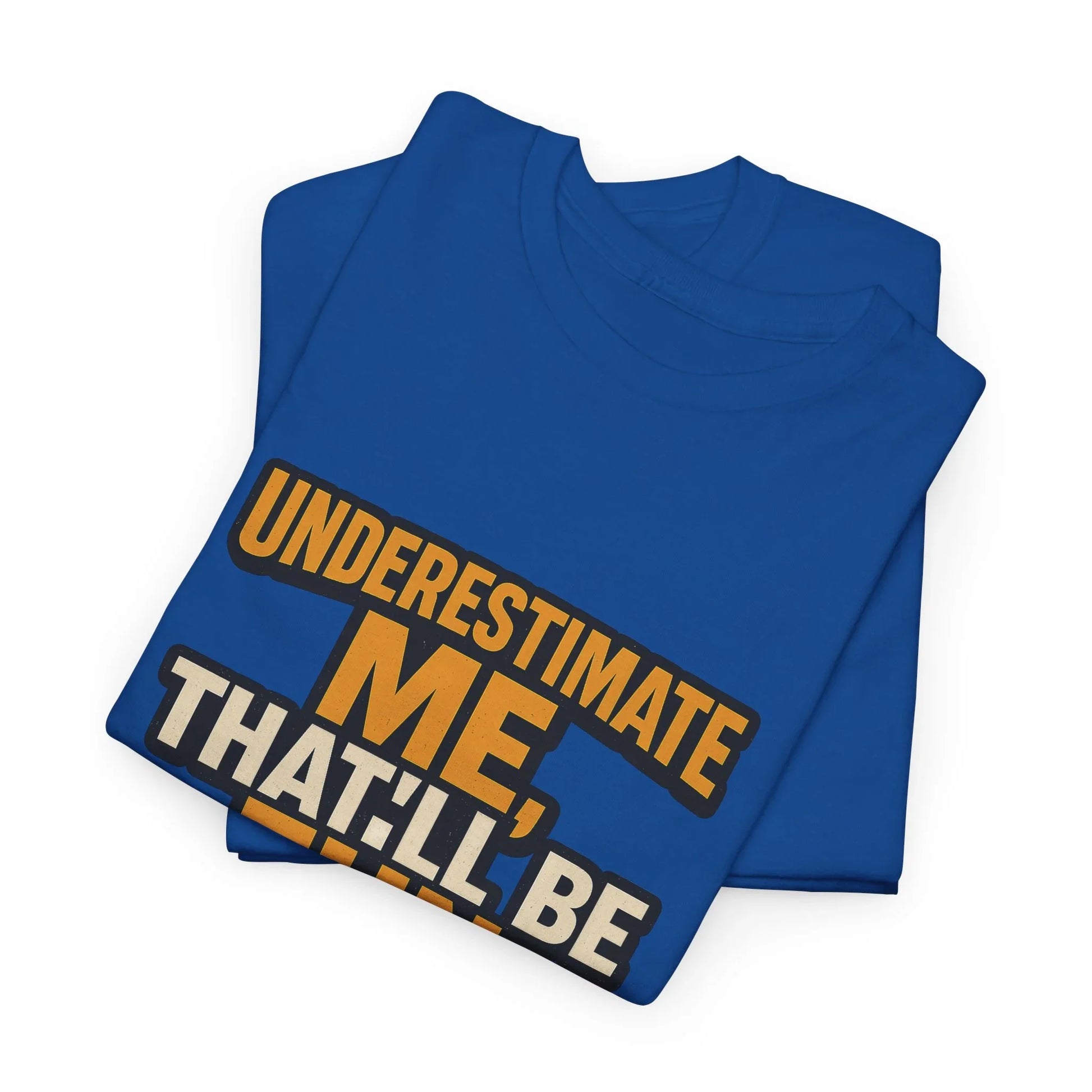 Folded blue t-shirt with bold 'Underestimate Me, That’ll Be Fun' motivational quote