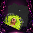 Folded black Deseraè Stephens Janaè Neon Majesty Portrait Tee showing the neon green portrait artwork and Exoticool neck branding