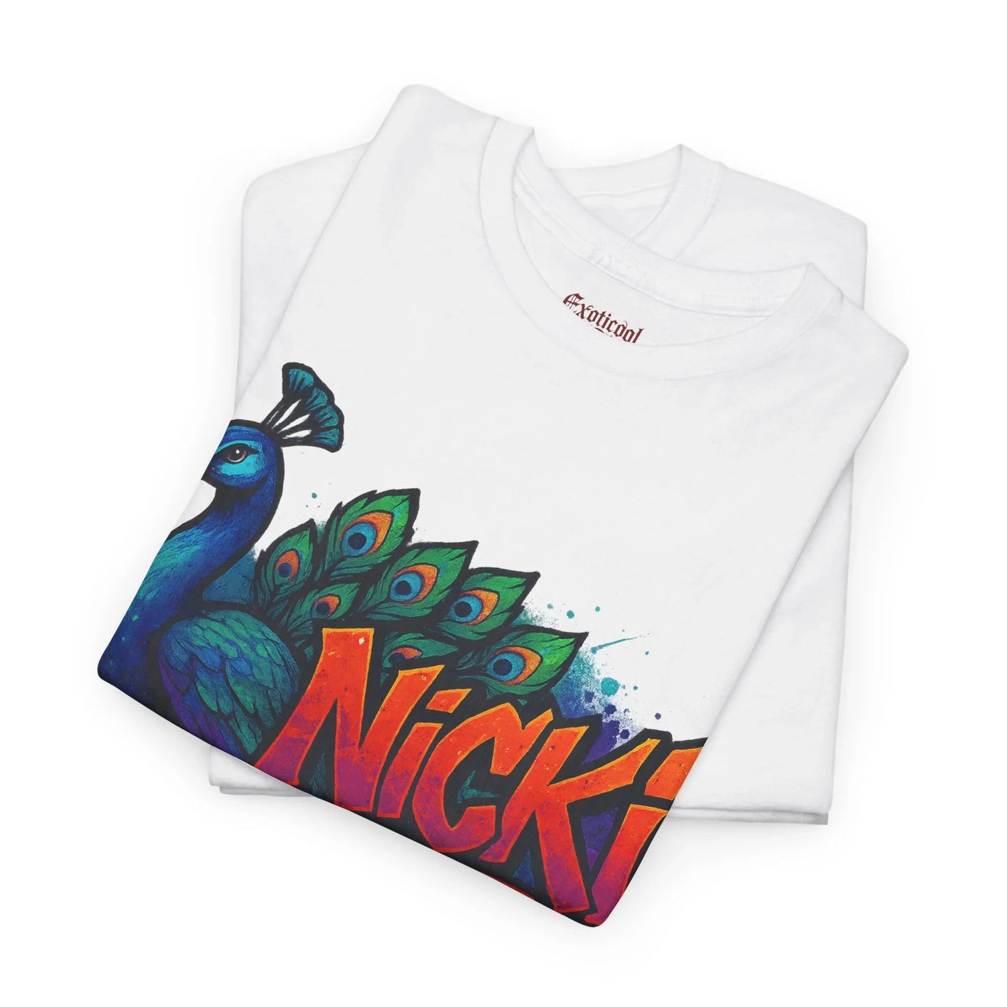 White graphic tee with vibrant peacock and bold Nicki text, folded neatly