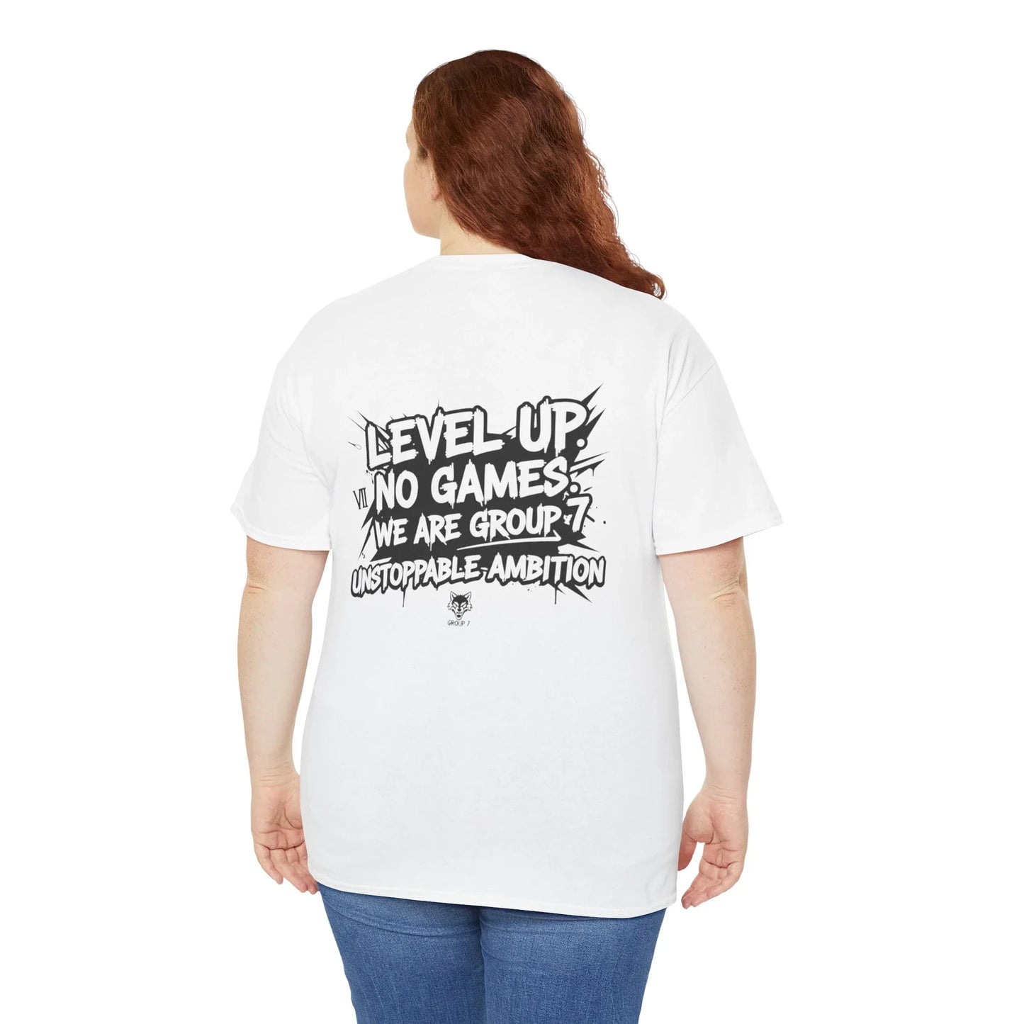 Woman wearing white graphic t-shirt with 'Level Up, No Games, We Are Group 7, Unstoppable Ambition' text