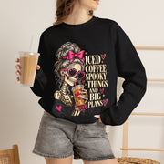 Woman wearing the Iced Coffee & Big Plans black crewneck sweatshirt in a casual fall setting