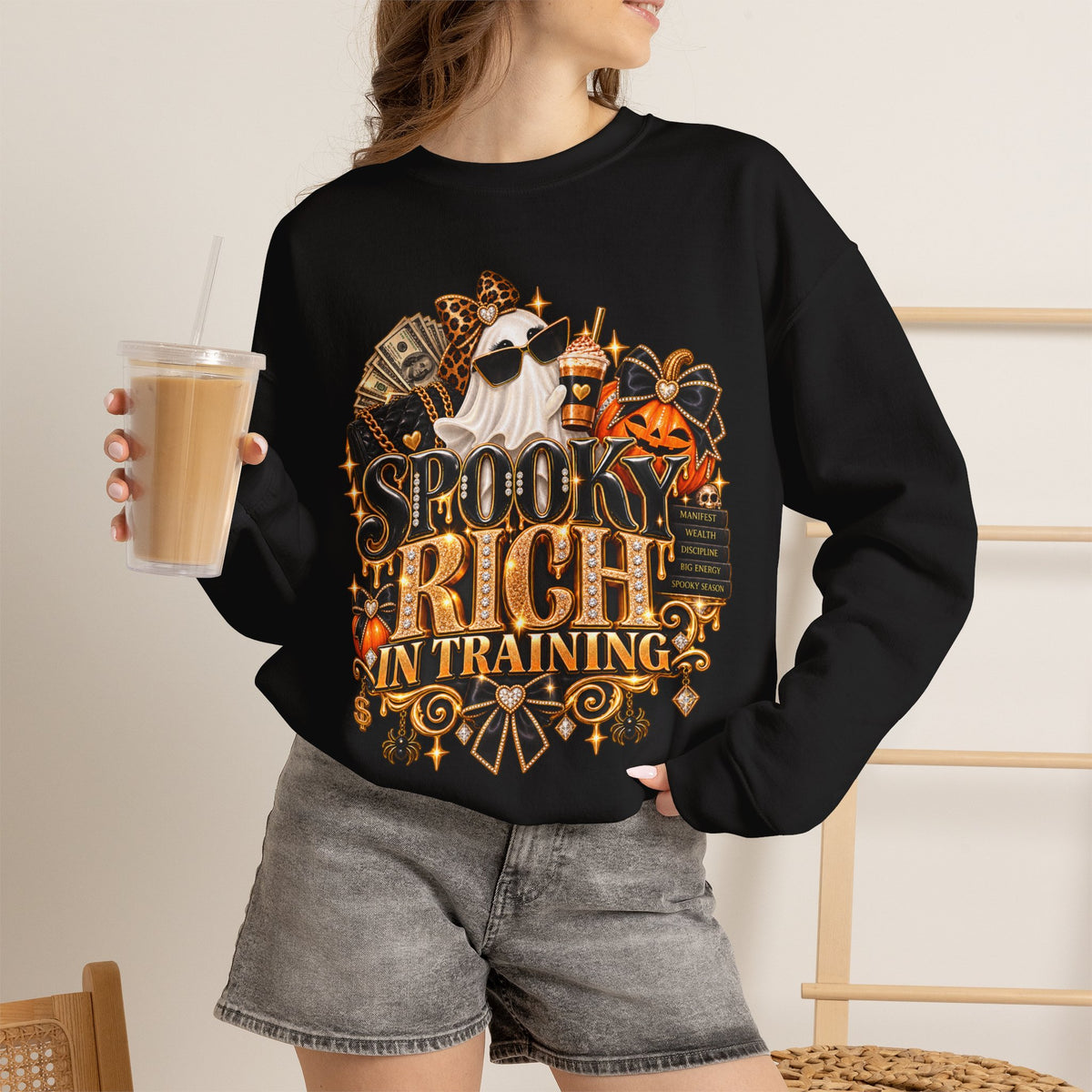 Woman wearing the Spooky Rich in Training black crewneck sweatshirt in a casual fall lifestyle setting