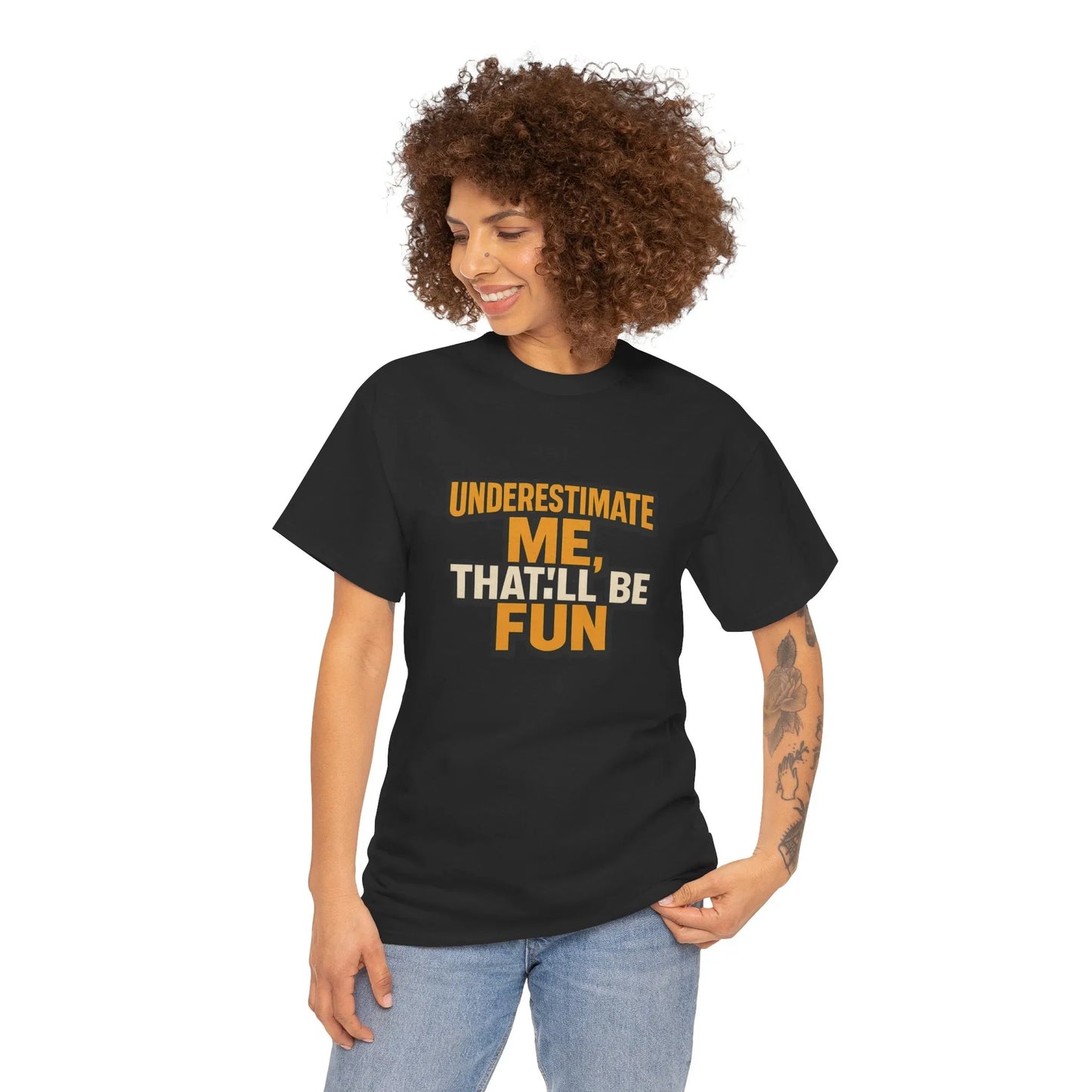 Woman wearing black graphic t-shirt with 'Underestimate Me, That'll Be Fun' text, casual style
