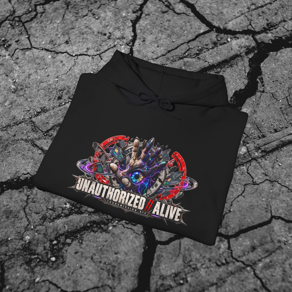 Folded black cyberpunk graphic hoodie showing the vivid front artwork and heavyweight fabric against a concrete background