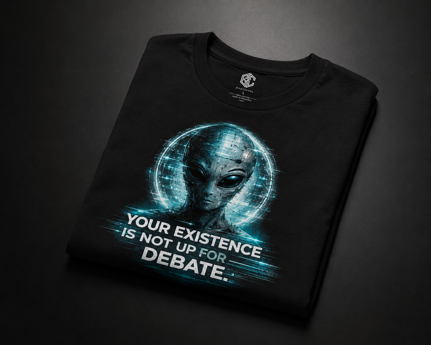 Folded black Your Existence Is Not Up for Debate alien graphic tee with cyan artwork.