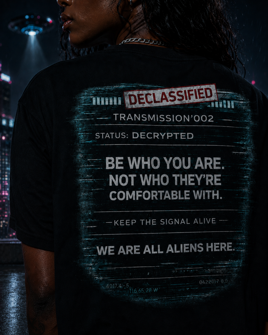 Close-up of the alien graphic tee back print featuring the declassified statement design.