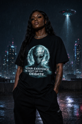 Black trans woman wearing the Your Existence Is Not Up for Debate alien graphic tee beneath a UFO.