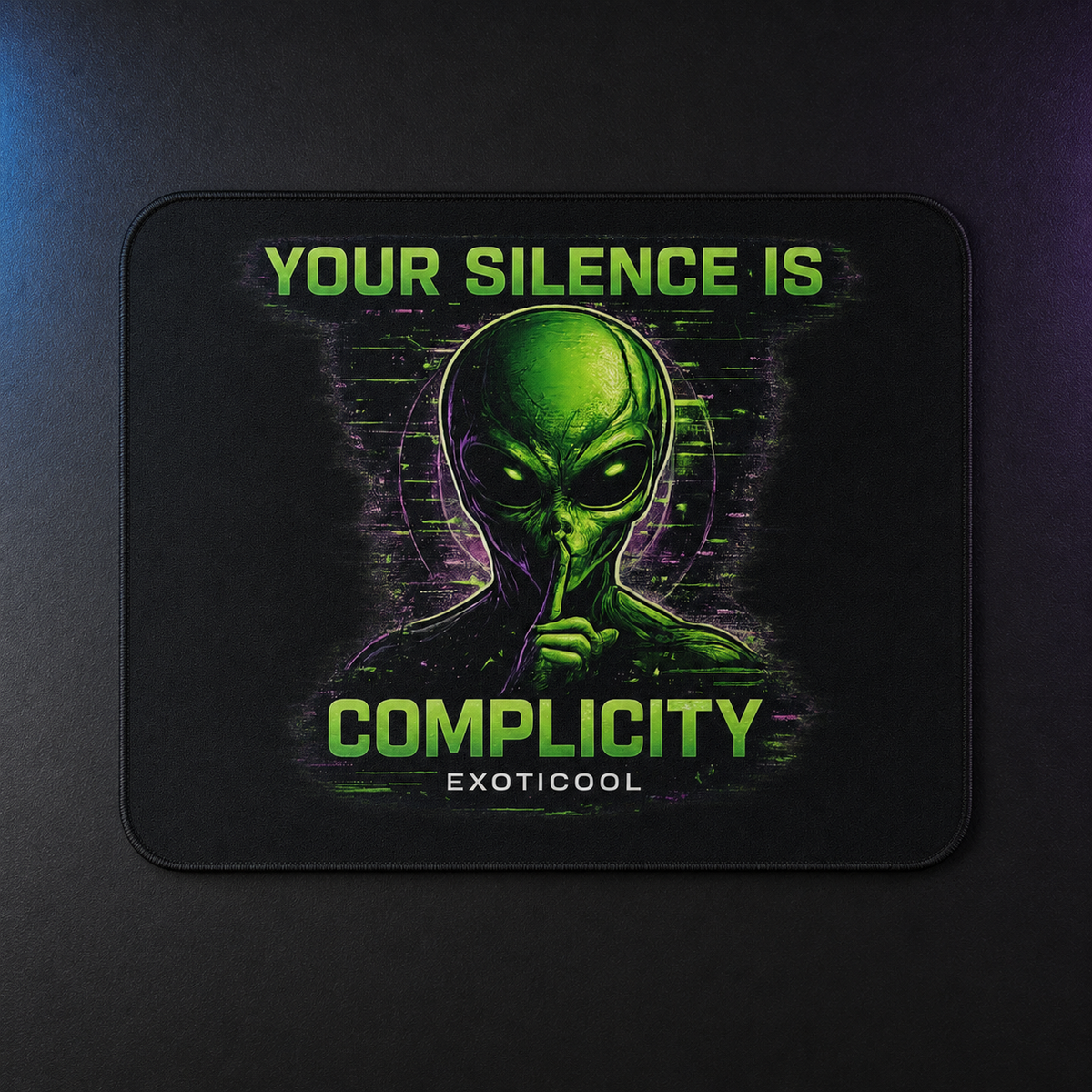 Overhead view of the rectangular alien mouse pad featuring neon-green alien artwork with distressed purple signal effects.