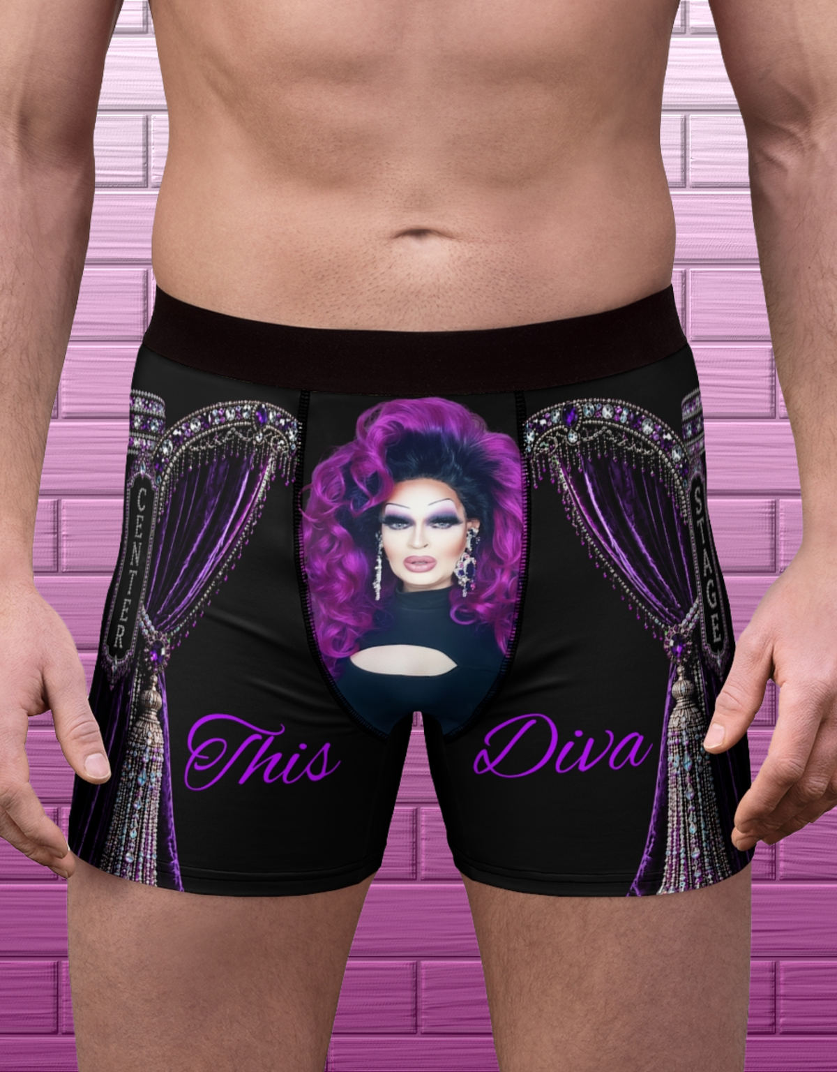 Adult model wearing black drag glam boxer briefs with portrait front graphic and purple jeweled stage design