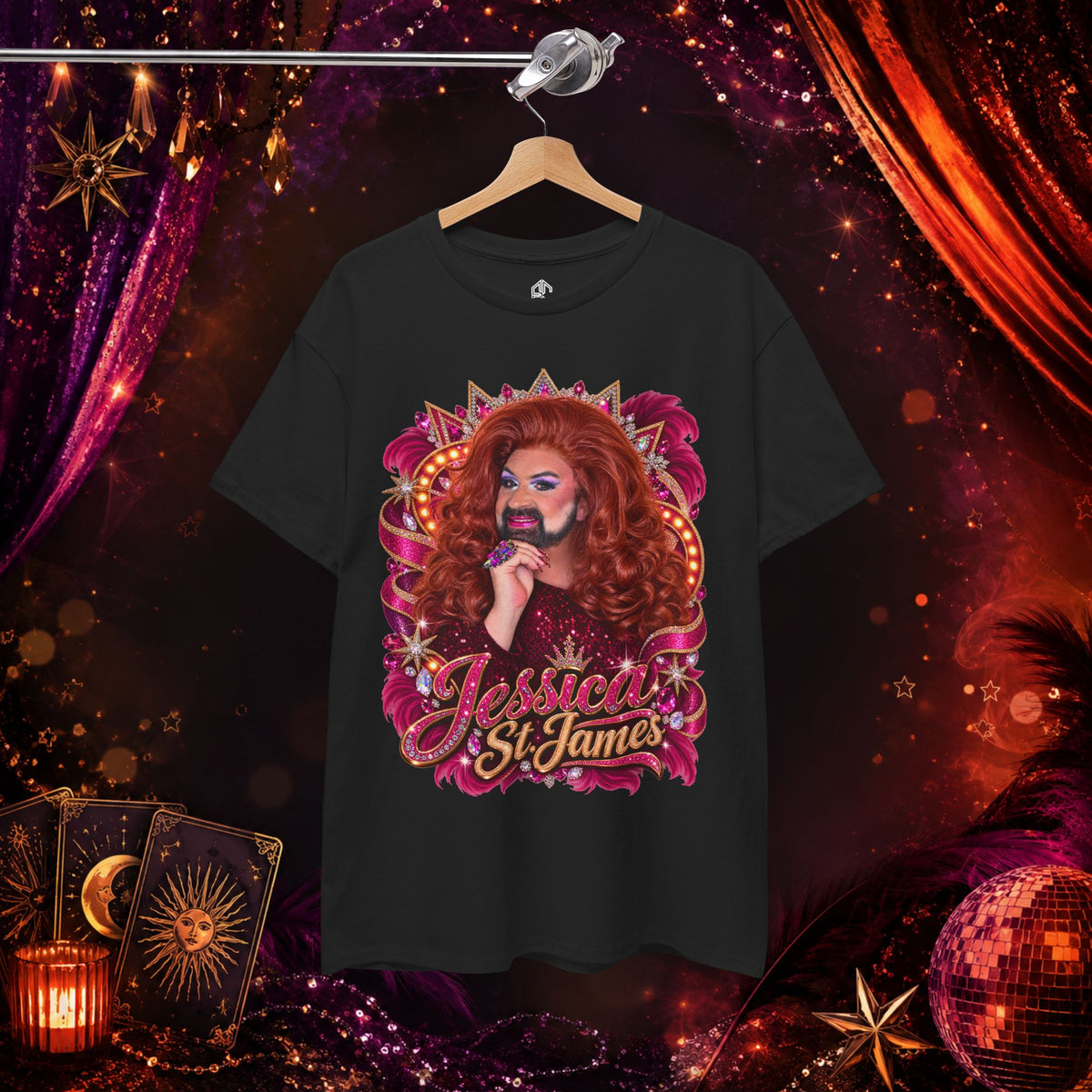 Jessica St. James black heavy cotton graphic tee hanging against a glamorous stage-inspired background