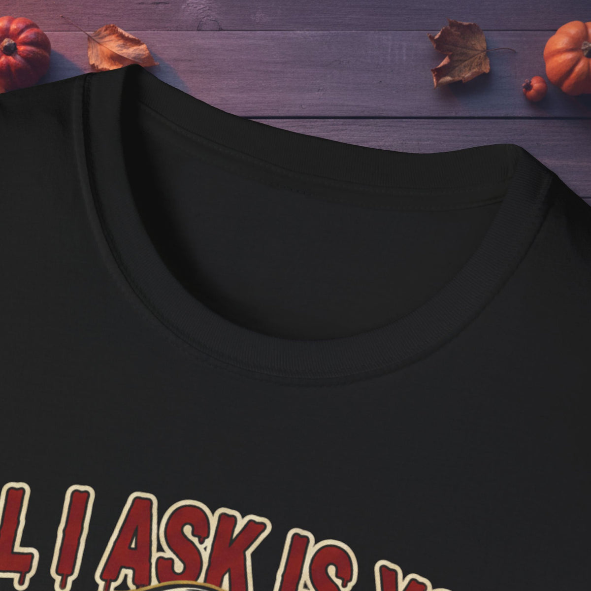 Close-up of neckline and front artwork on the All I Ask Is You Creep It Real Halloween tee in black