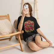Woman wearing the Manifest First, Panic Later black heavyweight graphic tee in a casual lifestyle setting