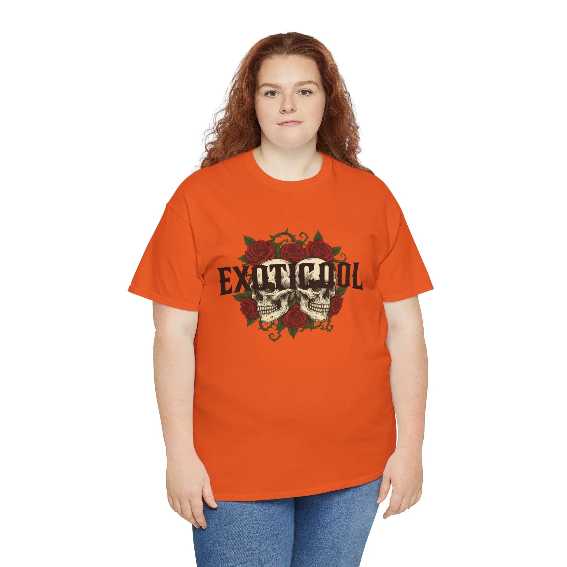 Woman in orange graphic t-shirt with skulls, roses, and EXOTICOOL text, casual fashion