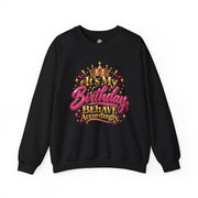 Black It’s My Birthday Behave Accordingly sweatshirt with pink and gold crown graphic
