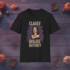 Classy Boujee Batsh*t Halloween graphic tee in black, front view on dark wood background