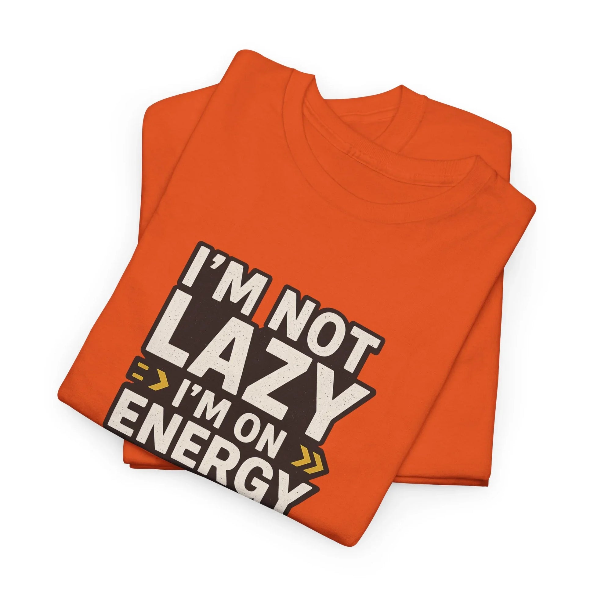 Orange graphic t-shirt folded with bold text saying I'm Not Lazy I'm On Energy