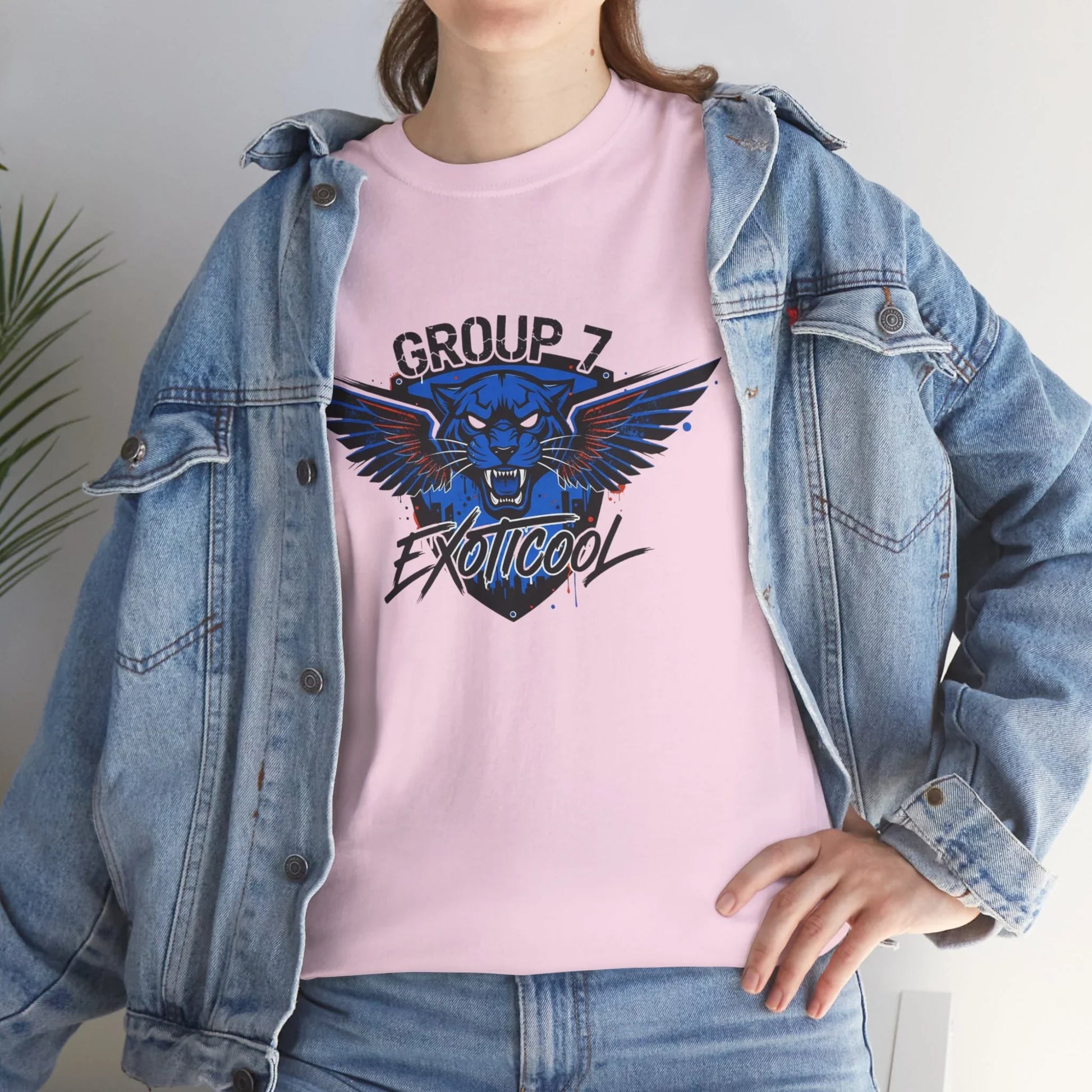 Woman in denim jacket wearing pink Group 7 Exoticool graphic t-shirt with panther design