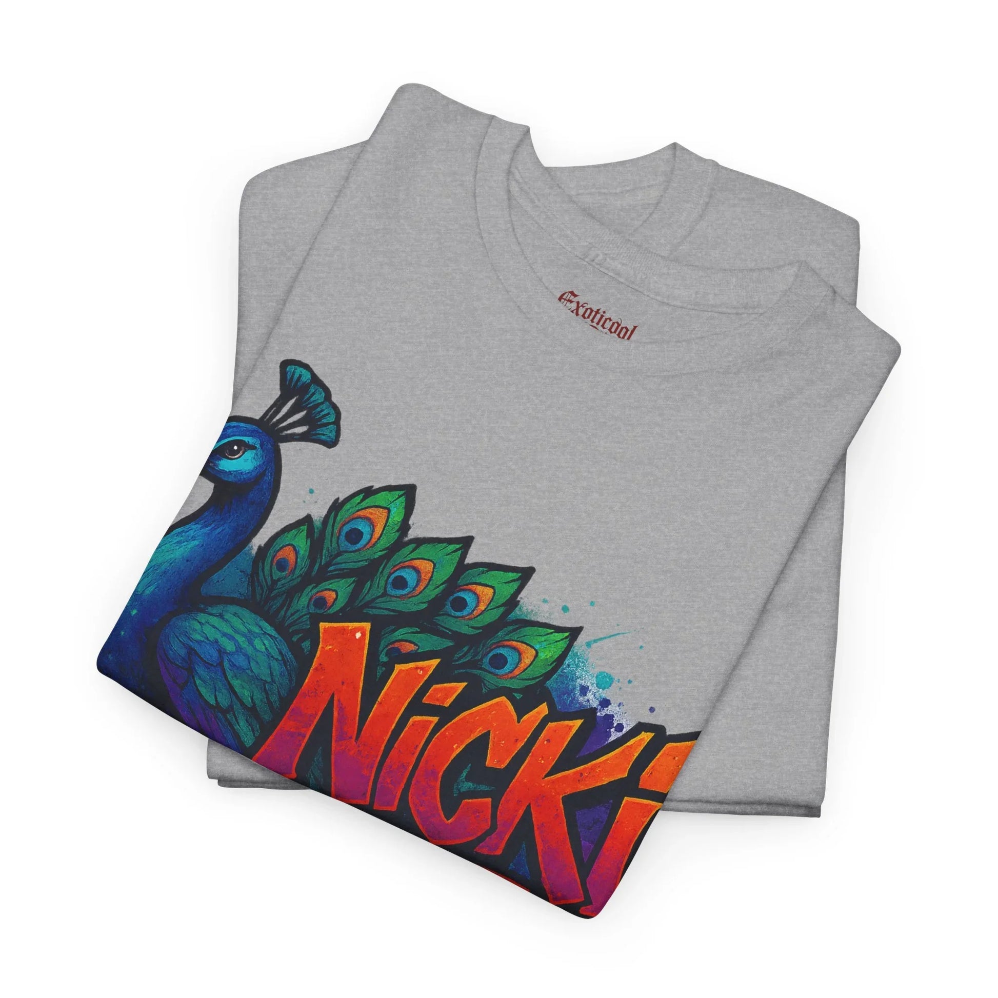 Gray t-shirt with colorful peacock graphic and bold Nicki text, folded, Exoticoo label visible