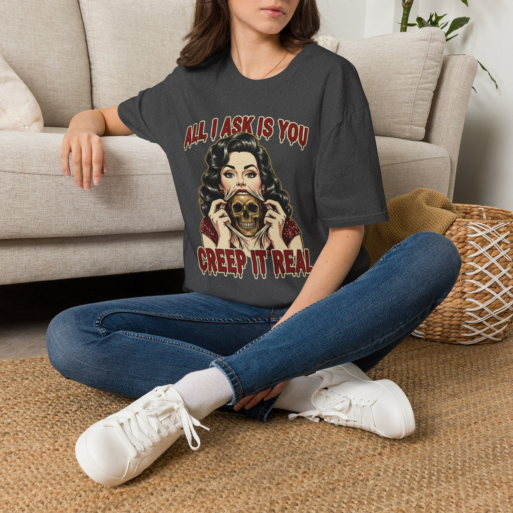 Seated model wearing the All I Ask Is You Creep It Real Halloween graphic tee in dark heather