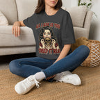 Seated model wearing the All I Ask Is You Creep It Real Halloween graphic tee in dark heather