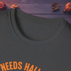 Close-up of neckline and front print on the Who Needs Halloween? tee in black