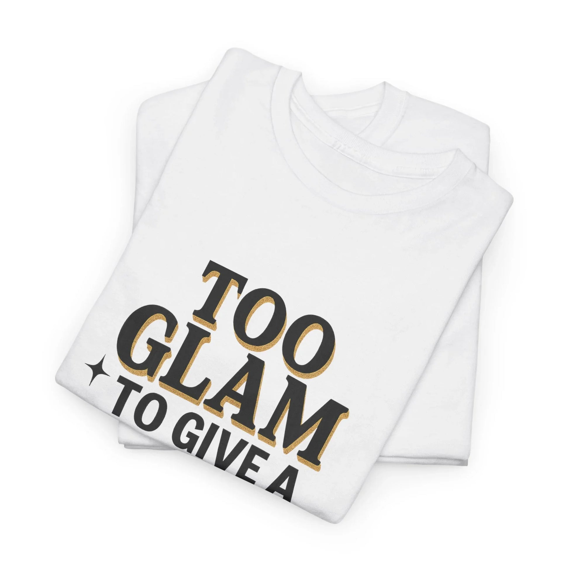 Folded white t-shirt with 'Too Glam To Give A' black and gold text design
