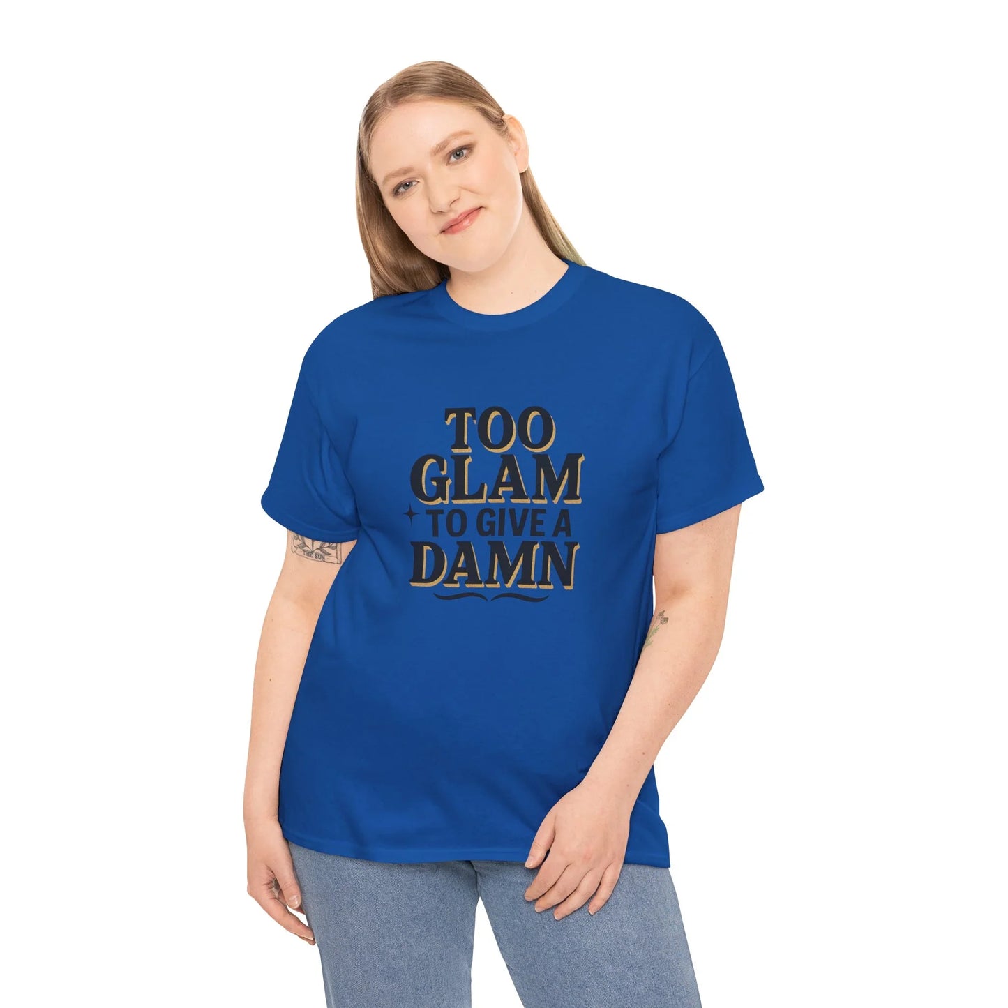 Smiling woman in blue graphic t-shirt with 'Too Glam to Give a Damn' slogan, casual style