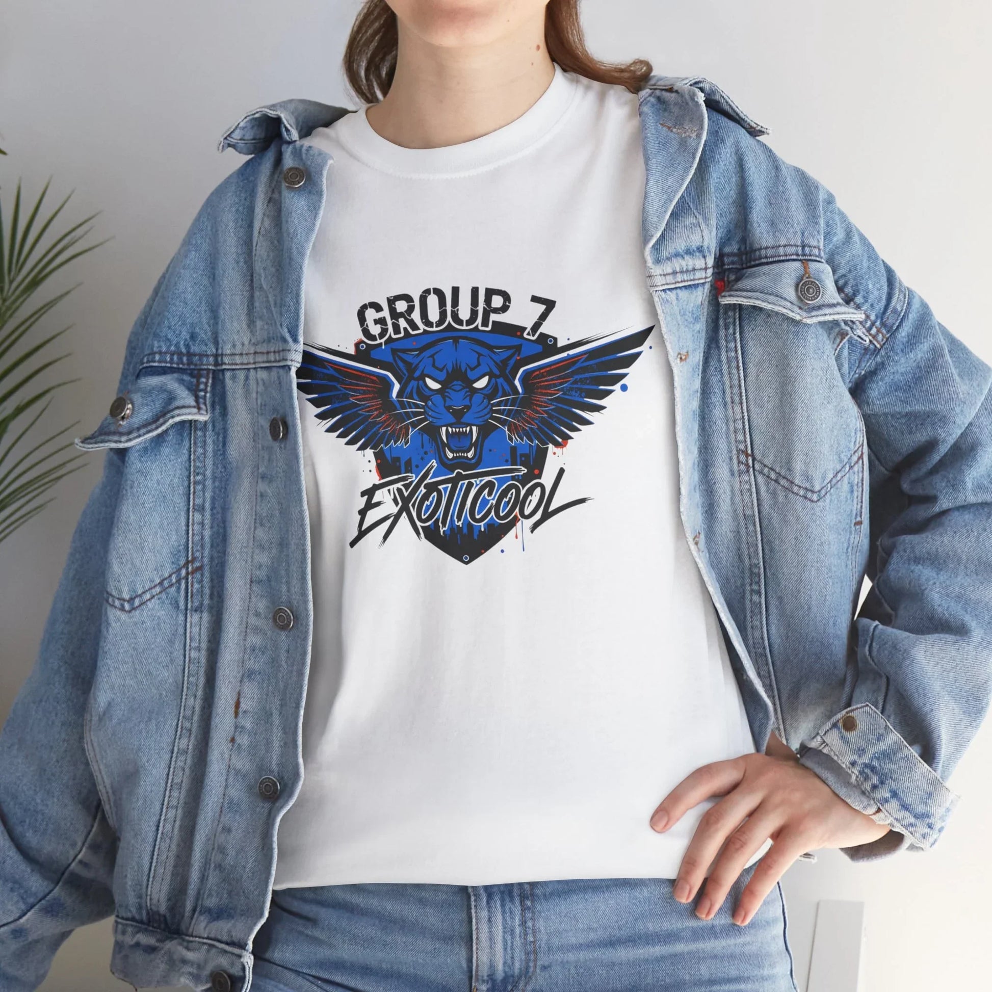Woman in denim jacket wearing white Group 7 Exoticoool graphic t-shirt