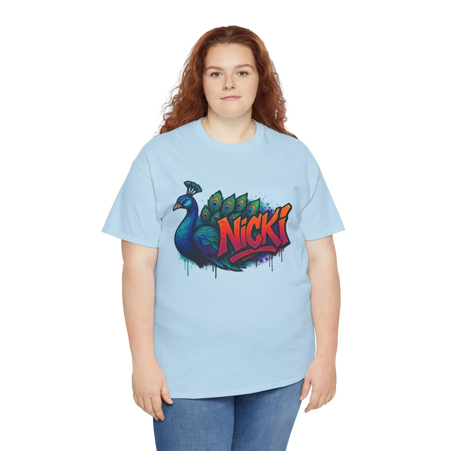 Woman in light blue t-shirt with colorful peacock and Nicki graffiti graphic