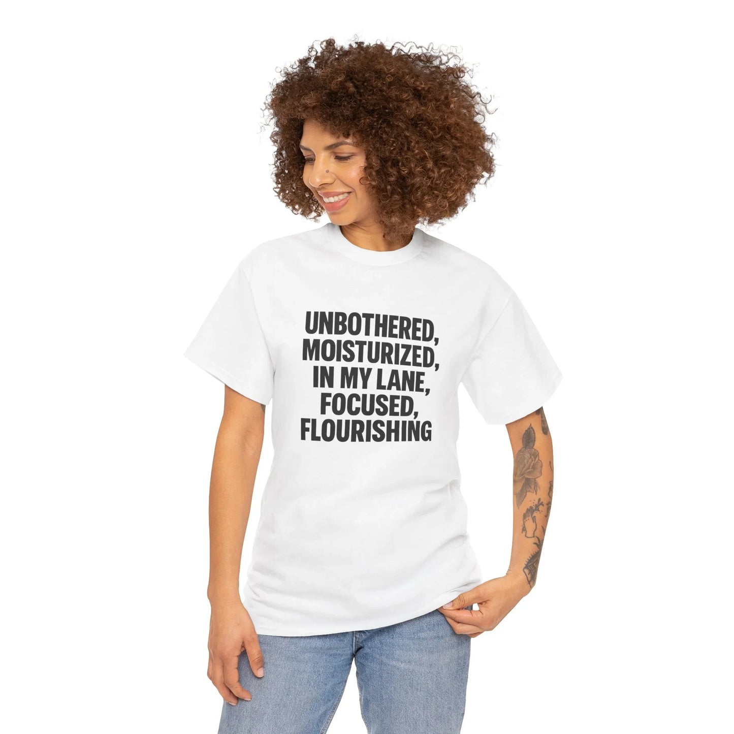 Woman in white graphic t-shirt with positive slogan, casual fashion apparel, curly hair
