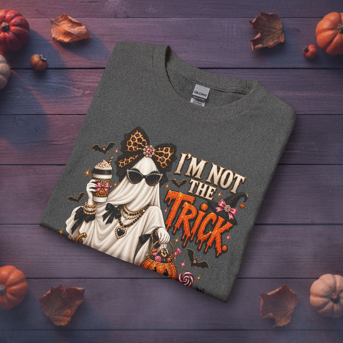 Folded charcoal Halloween long sleeve shirt featuring I’m Not the Trick I Am the Treat spooky glam artwork