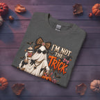 Folded charcoal Halloween long sleeve shirt featuring I’m Not the Trick I Am the Treat spooky glam artwork
