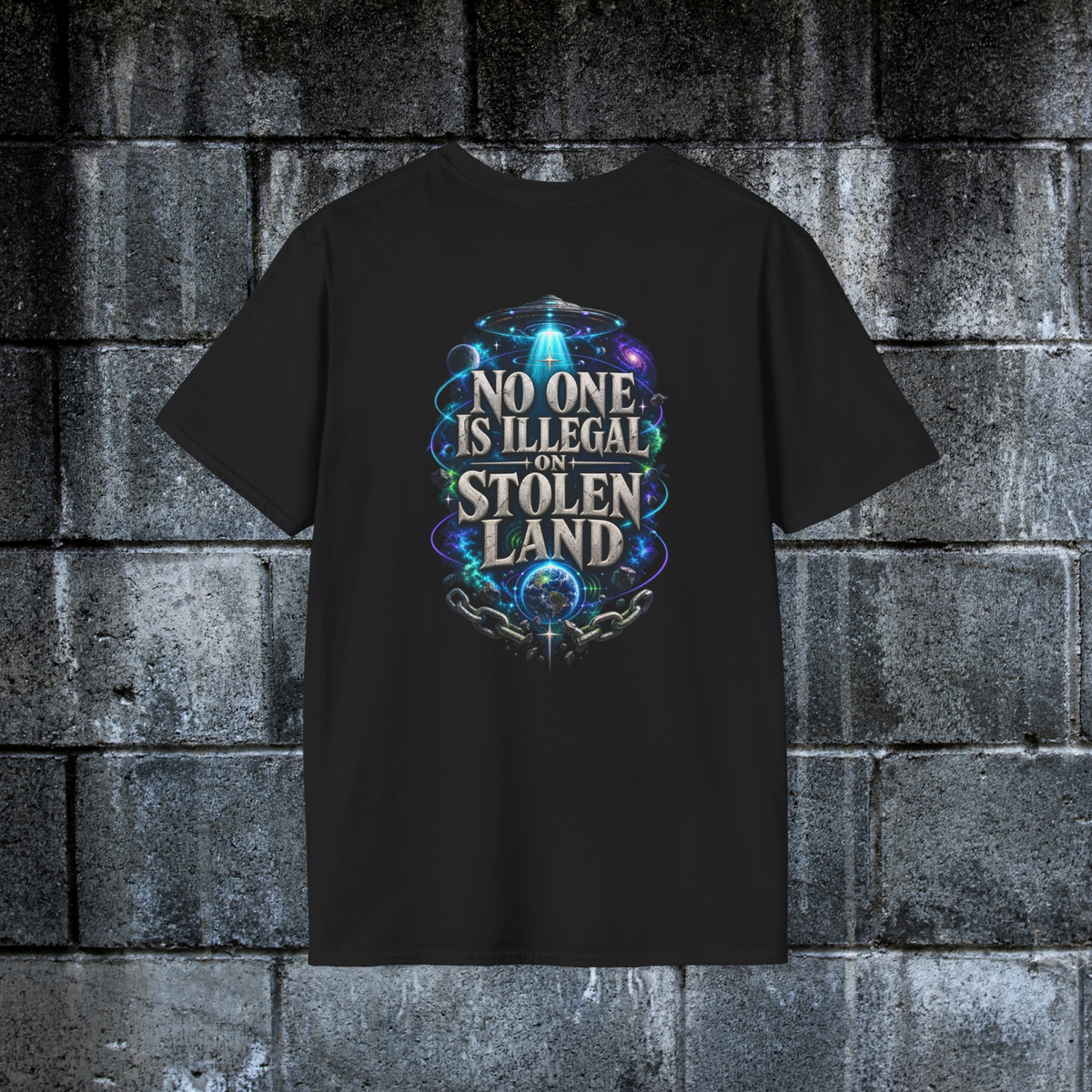 Back of black graphic tee featuring No One Is Illegal on Stolen Land cosmic artwork