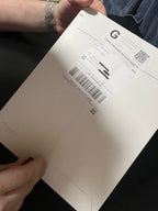 Wider view of the mailed package containing the Exoticool bumper sticker
