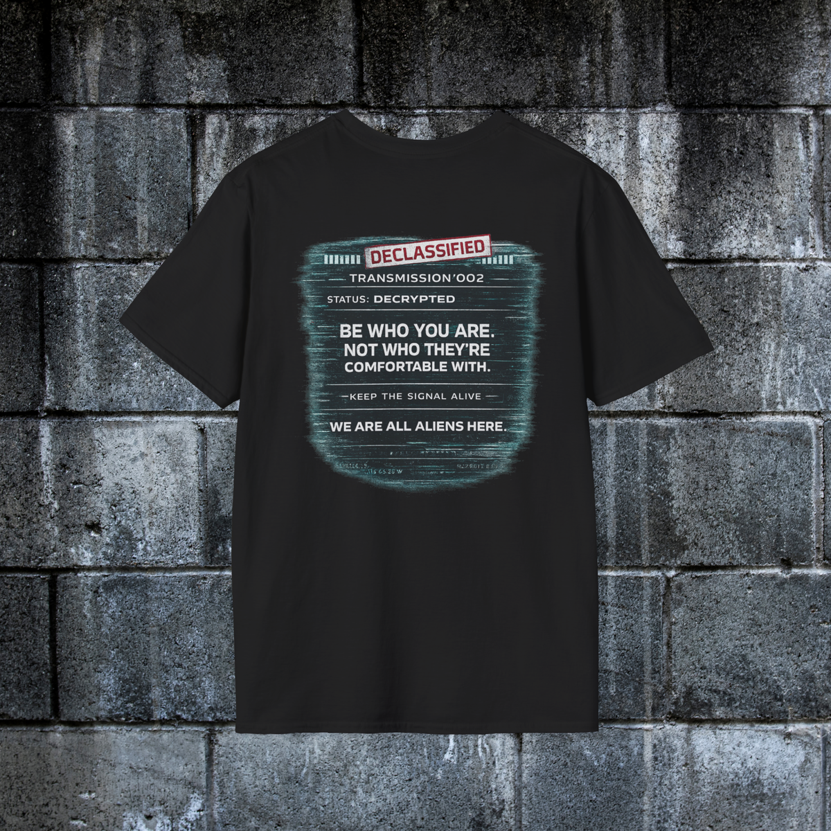 Back of black alien statement tee reading Be Who You Are Not Who They’re Comfortable With