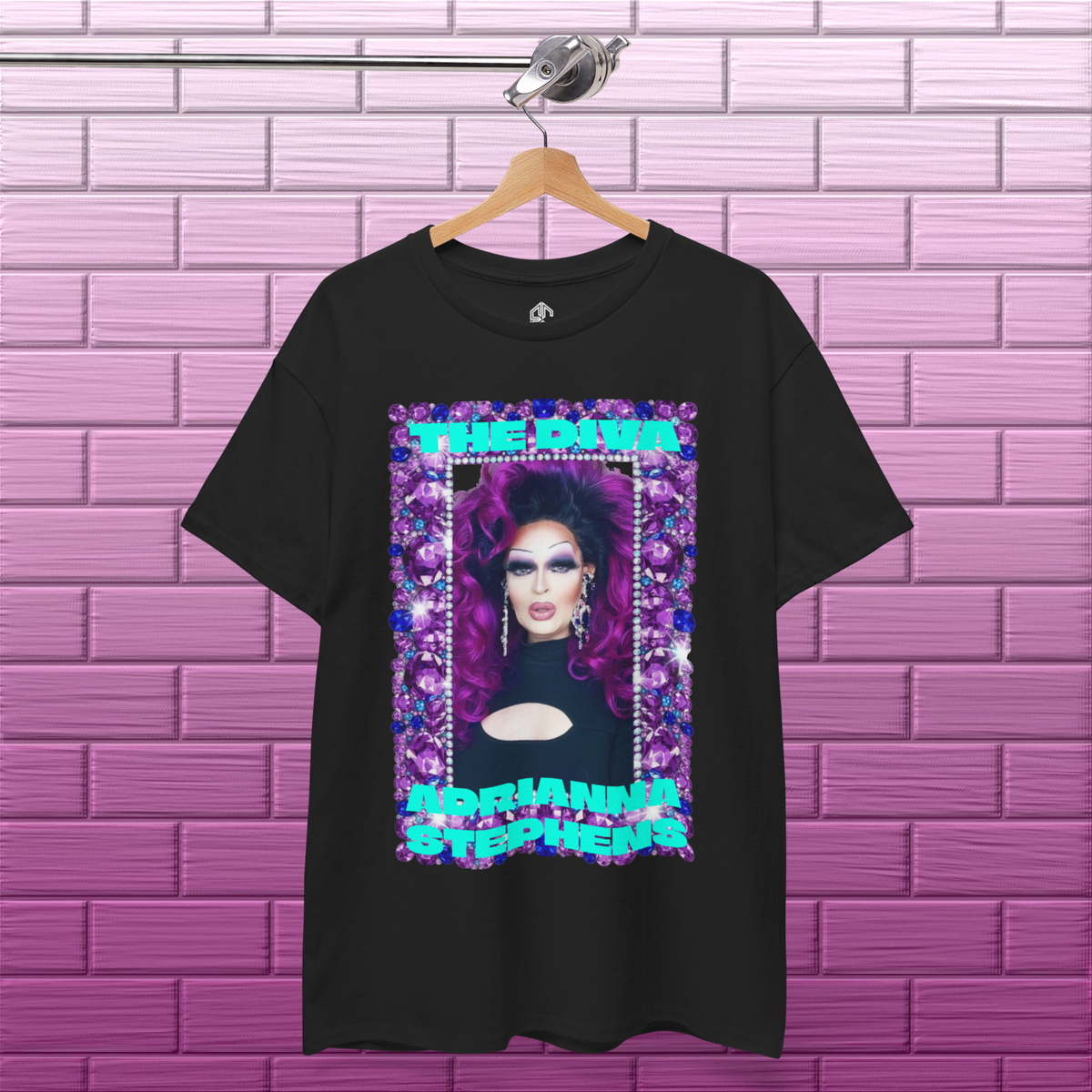 Black Adrianna Stephens Purple Reign Diva graphic T-shirt hanging against a textured concrete background
