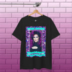 Black Adrianna Stephens Purple Reign Diva graphic T-shirt hanging against a textured concrete background