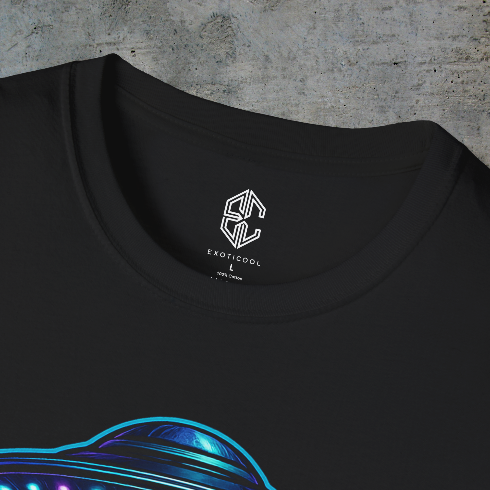 Close-up of the Exoticool printed neck label and collar on the black alien signal graphic tee