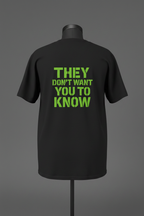 Back of black Exoticool Alien Signal Tee featuring green “They Don’t Want You To Know” graphic