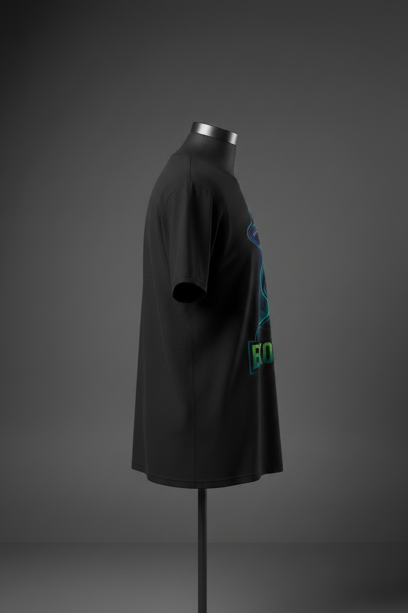 Left side view of black Exoticool Alien Signal Tee on mannequin showing fit and front alien graphic placement