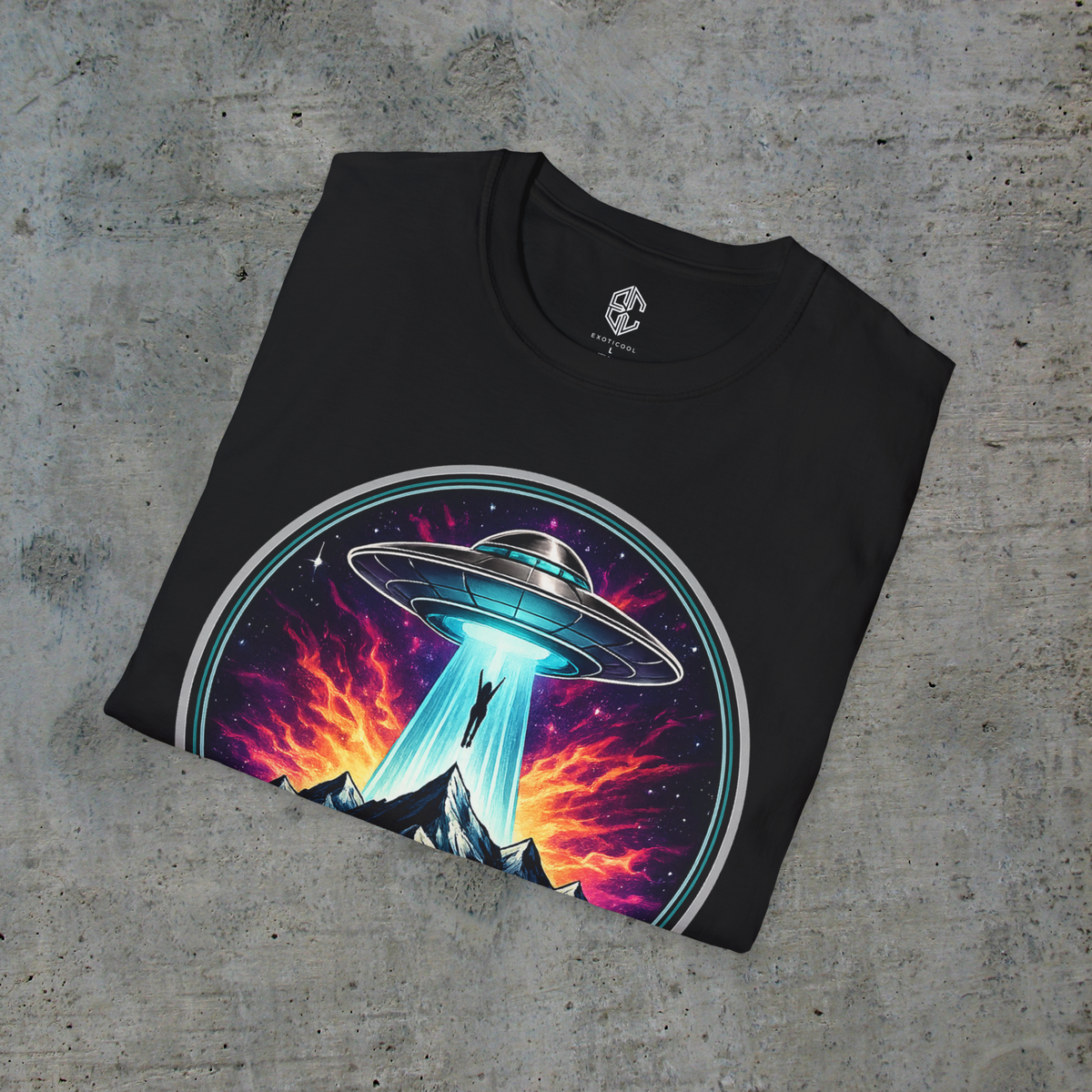 Folded black alien abduction graphic tee showing the UFO artwork and Exoticool printed neck label