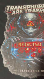 Close-up video of the Exoticool Transphobes Are Trash tee showing the real printed artwork, ink texture, colors and cyberpunk graphic details