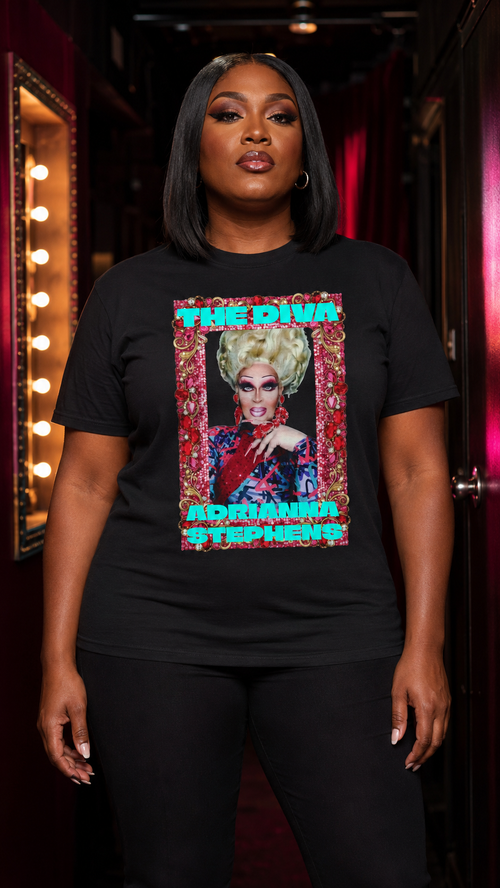 Plus-size Black model wearing the Adrianna Stephens The Diva black graphic T-shirt in a theatrical backstage corridor