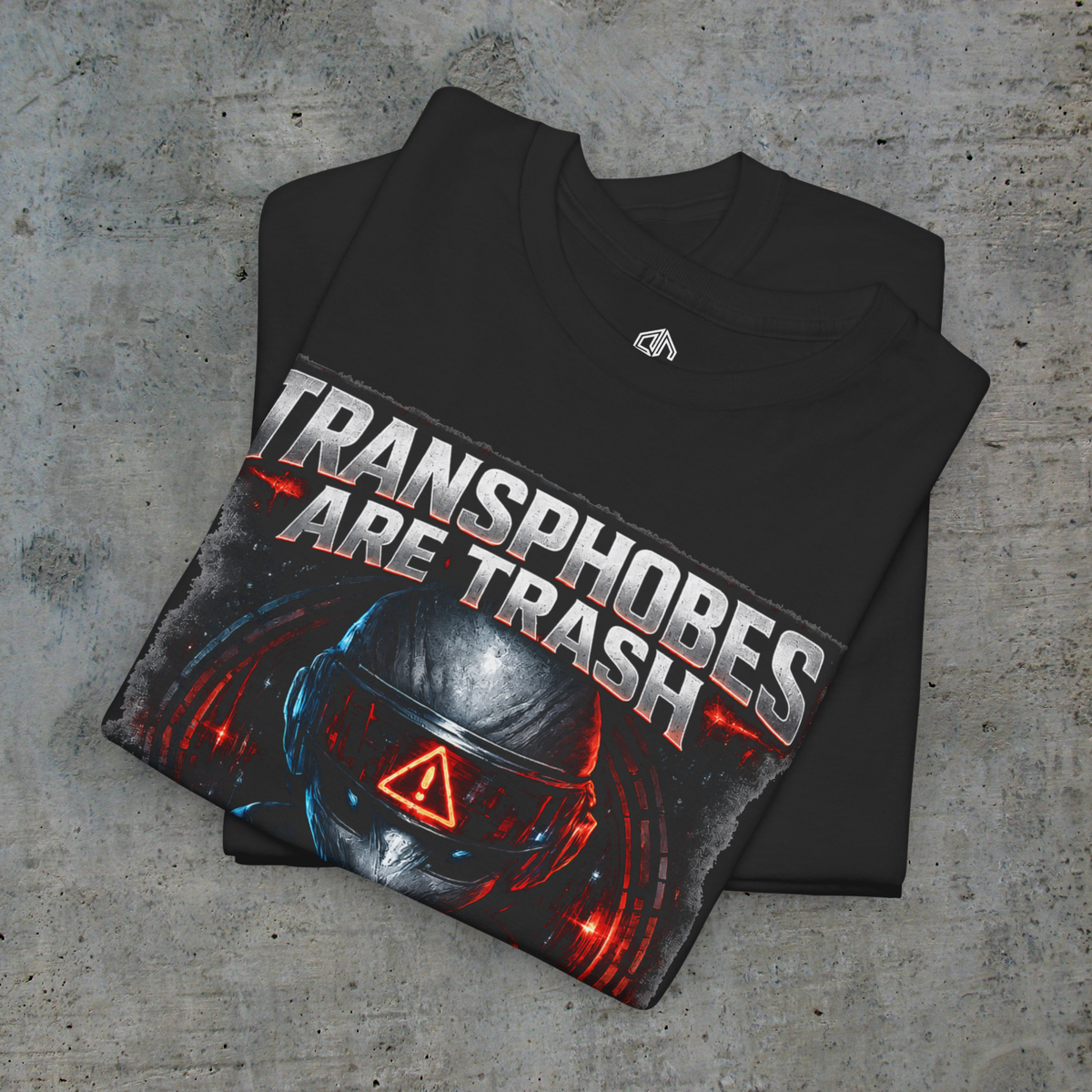 Folded black Transphobes Are Trash tee showing the front artwork and Exoticool printed neck label